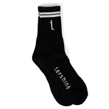 Svarta strumpor med vit logotyp och två vita ränder högst upp. Storlek 46-48.