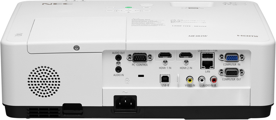 En projektor med flera anslutningar och knappar på ovansidan.