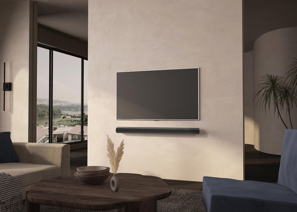 Väggfäste för Sonos ARC under en väggmonterad TV i modern inredning.