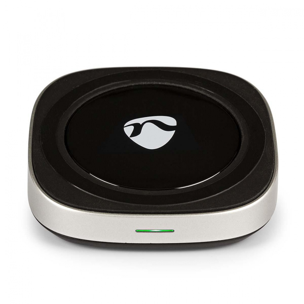 Trådlös QI-laddstation med USB-anslutning, rund design och indikatorlampa.