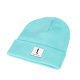 Tershine Mössa Beanie, turkos En turkos beanie-mössa med en vit logotag.