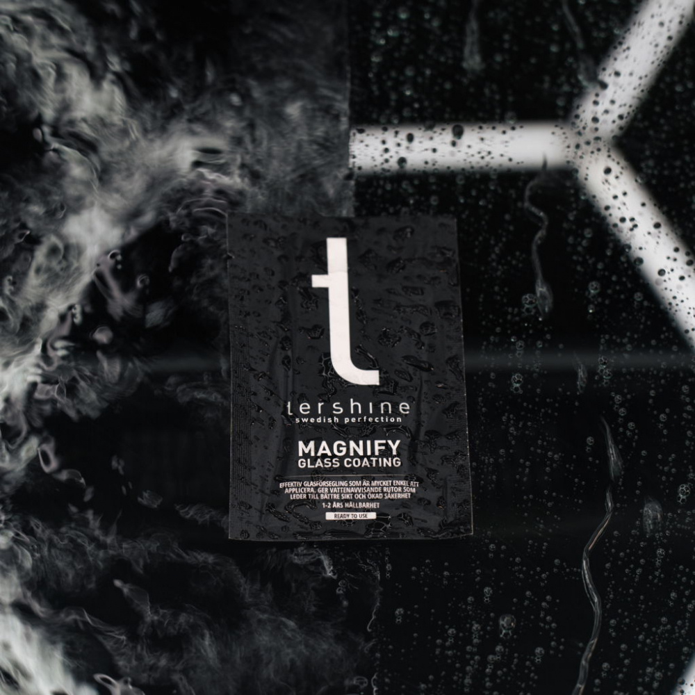 En produktförpackning för Tershine Magnify glasförsegling med vattendroppar.