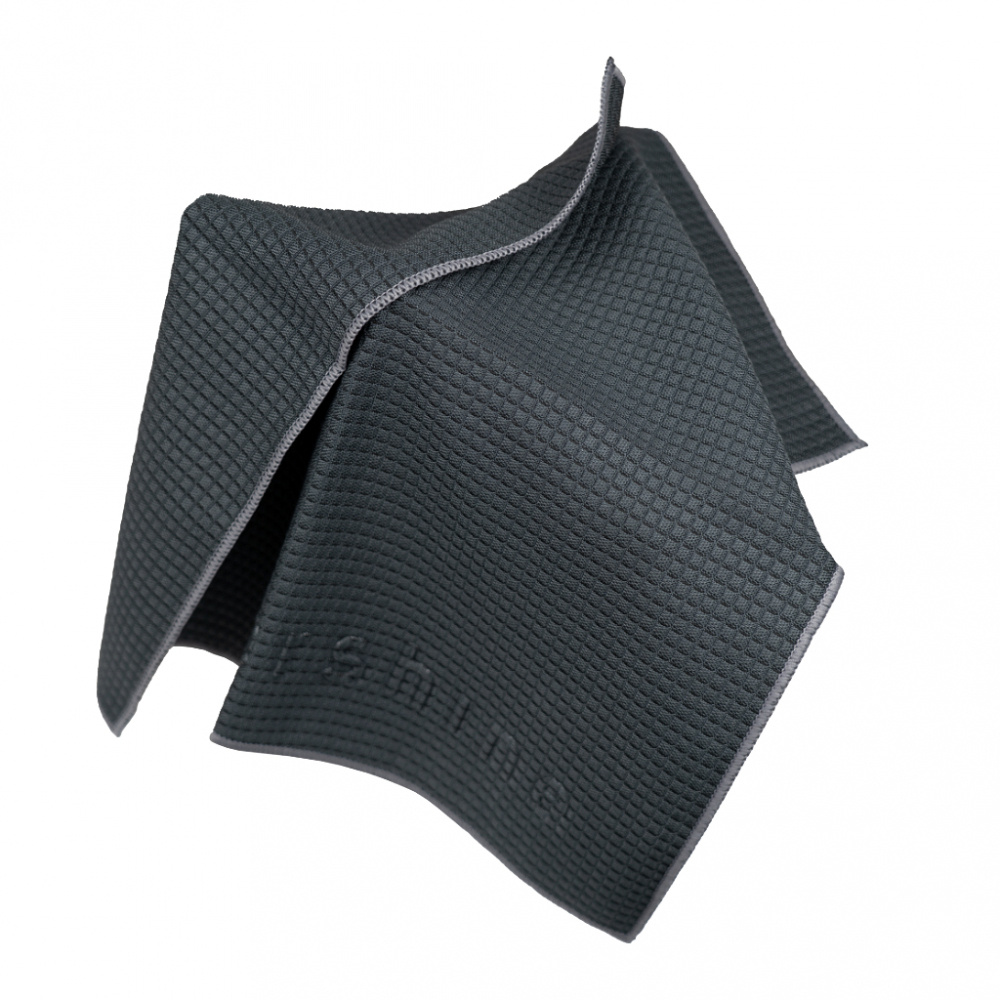 Mörkgrå mikrofiberduk med texturerat mönster och sytt kantband.