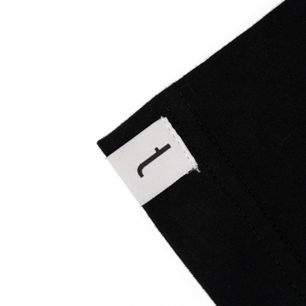 Svart t-shirt med etikett, oversized design, storlek XX-large.