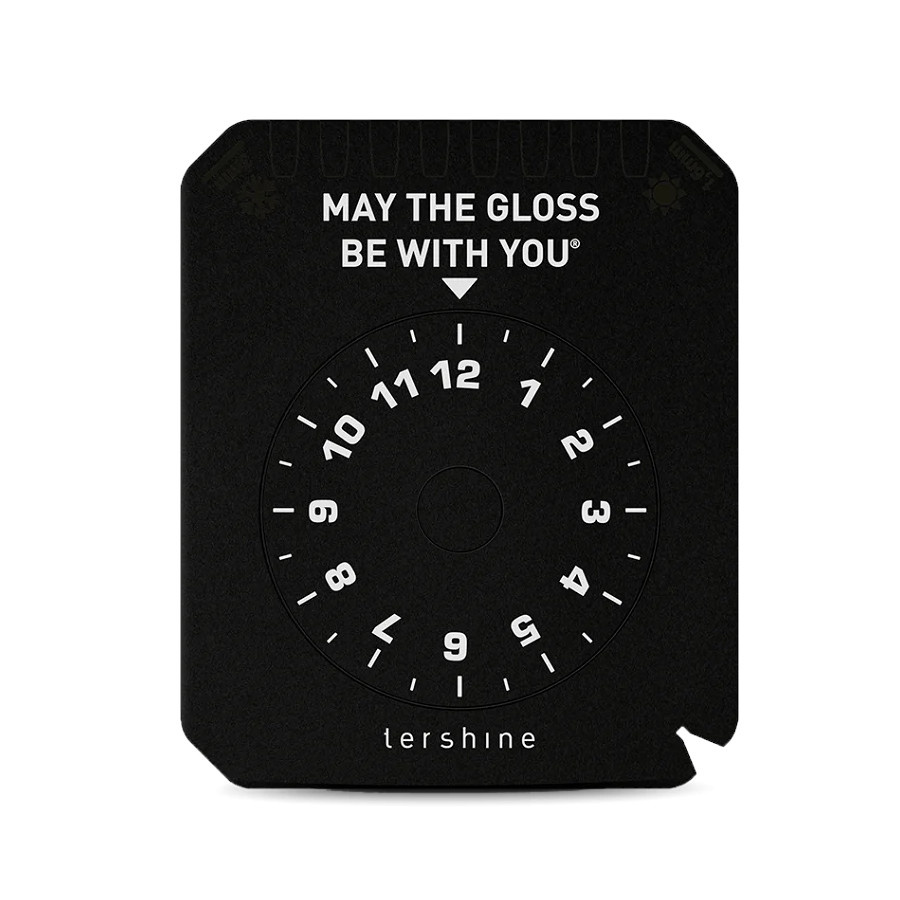 Svart isskrapa med skala och texten \