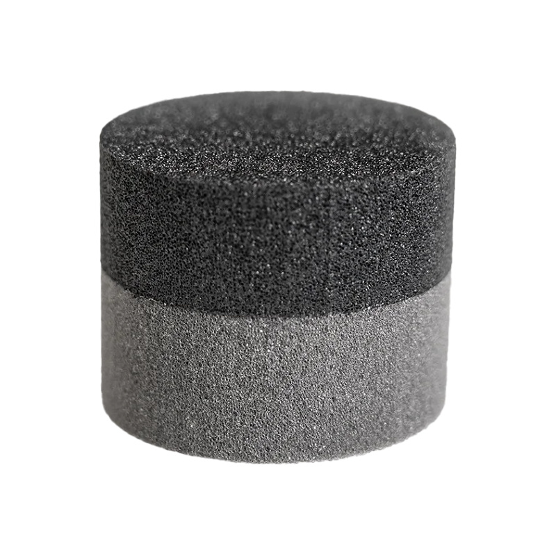 En rund vax-applikator med två lager av olika skum.