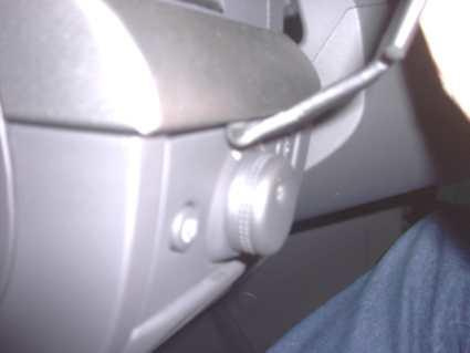 En kontrollreglage i bilen, troligtvis för justering av funktioner.