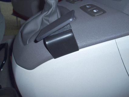 Konsol detalj från Fiat Idea, grå och svart plast, del av interiören.