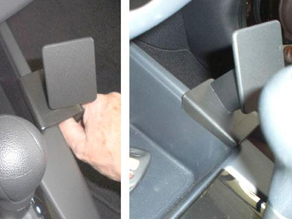 En konsol för Kia Cerato 10-11 med handtag.