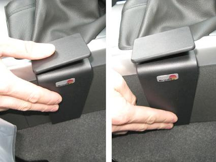 Konsolbeslag för Nissan Navara 11-15, med hand som justerar det.