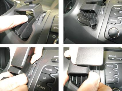 Centrerad kontrollpanel med funktioner och justeringar i Kia Sportage 11-15.