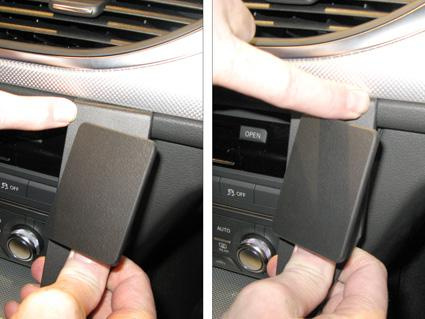 Visar en detalj av Audi A6 11-15 med fokus på en knapp eller panel.