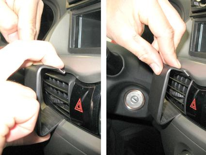 En hand justerar luftventilen i Mitsubishi i-MiEV.