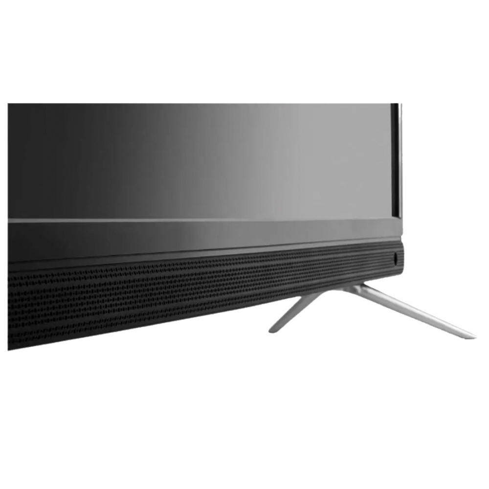 En TV med integrerad soundbar och stående ben i metall.