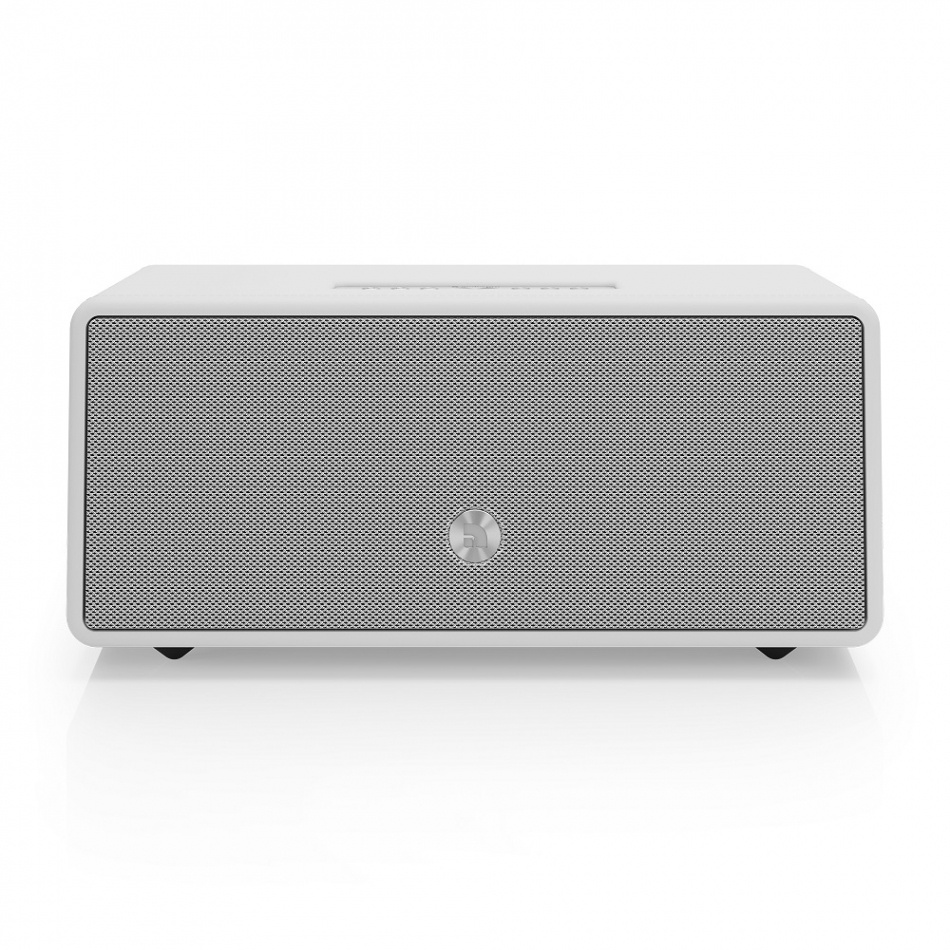 Vit högtalare med gallerframsida och minimalistisk design.