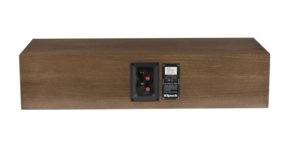 Centerhögtalare i valnötsträfanér med anslutningspanel bak.