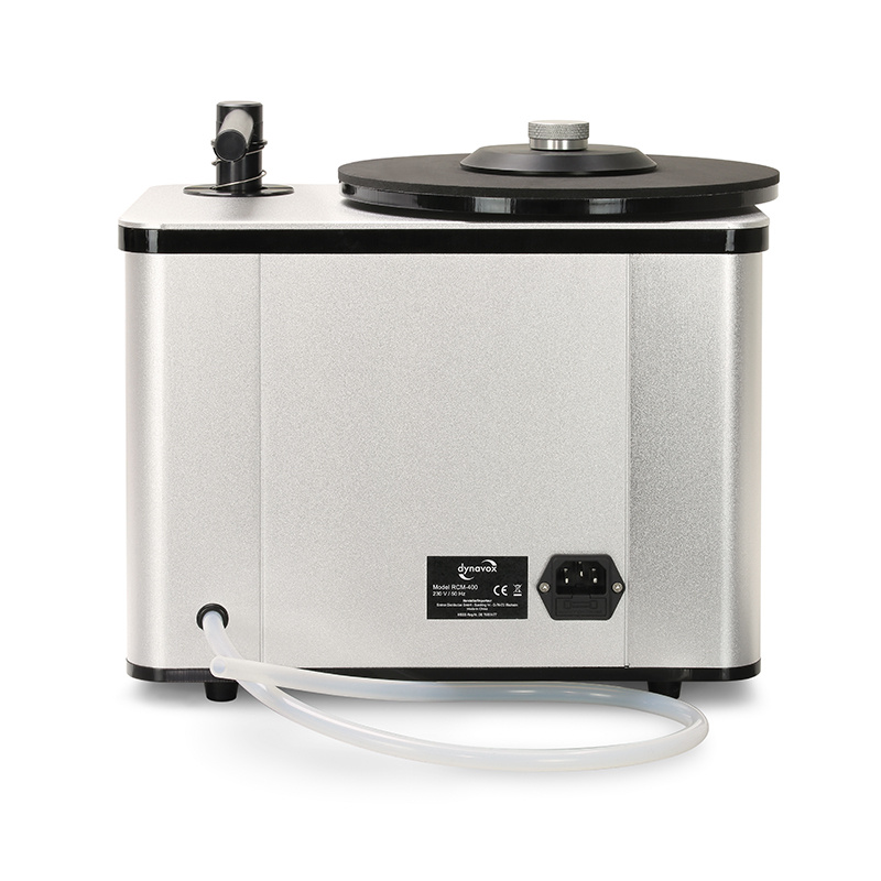 Motordriven skivtvätt med silverfärgad kropp och sugslang.