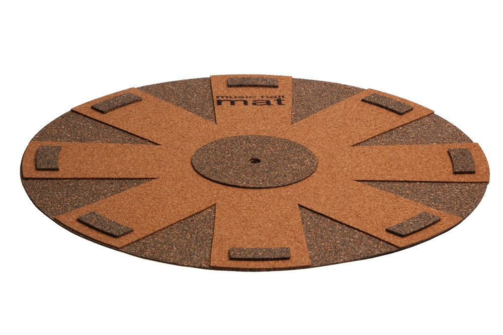 Rund korkmatta med detalj i mattbrun och grå nyans, designad för ljuddämpning.