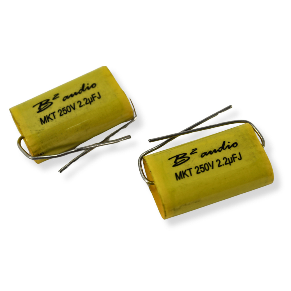 Två gula kondensatorer för ljudprodukter.