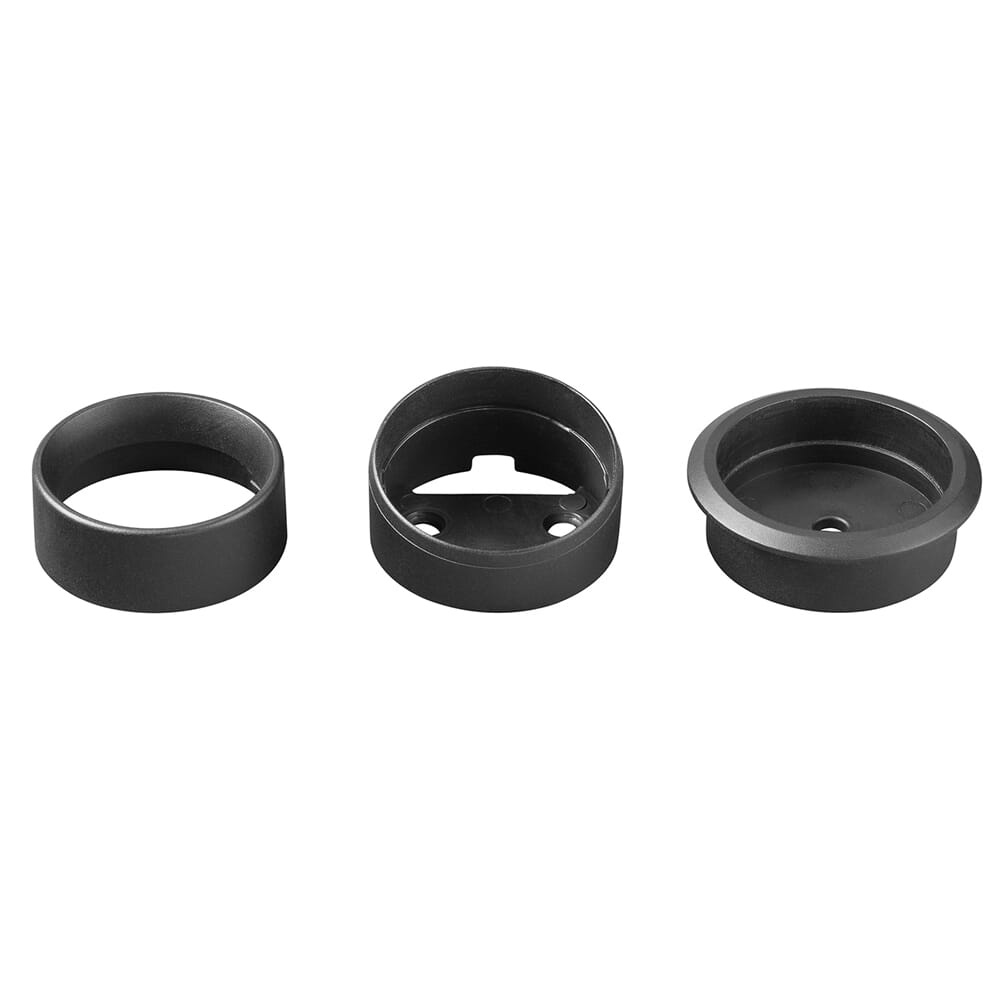 Tre olika svarta plastdelar, troligen monteringsdetaljer för ljudsystem.