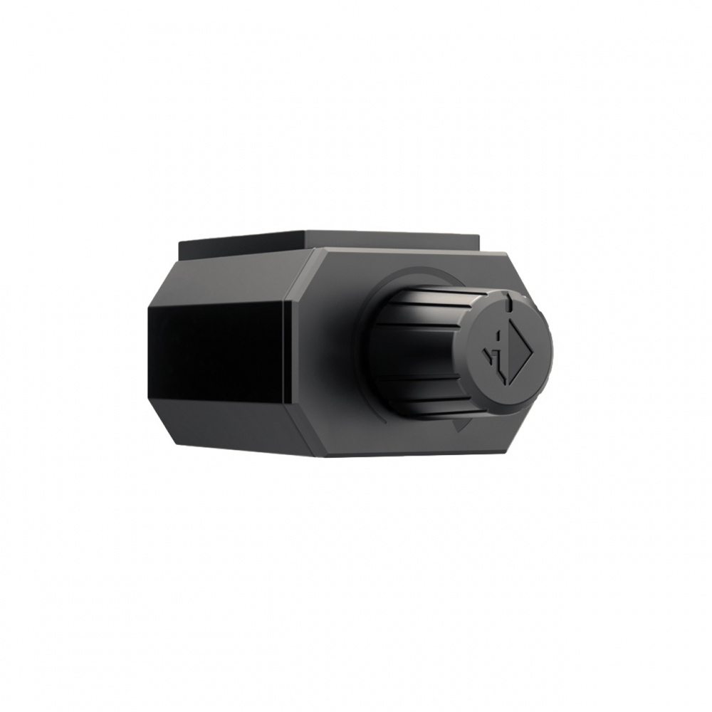 En svart rund kontroll med en hexagonal form för justering av ljud.