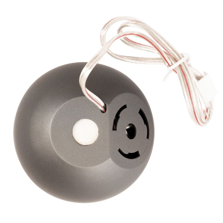 En rund bredbandsdiskant med två kablar och grå yta.