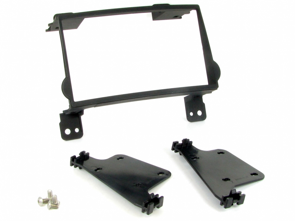 Monteringsram för dubbeldin stereo till Hyundai H1, inkluderar fästen och skruvar.