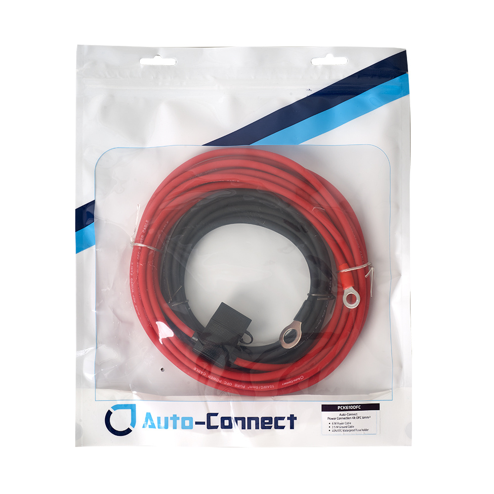 Strömkabelkit med röd och svart kabel, förpackad i plastpåse.