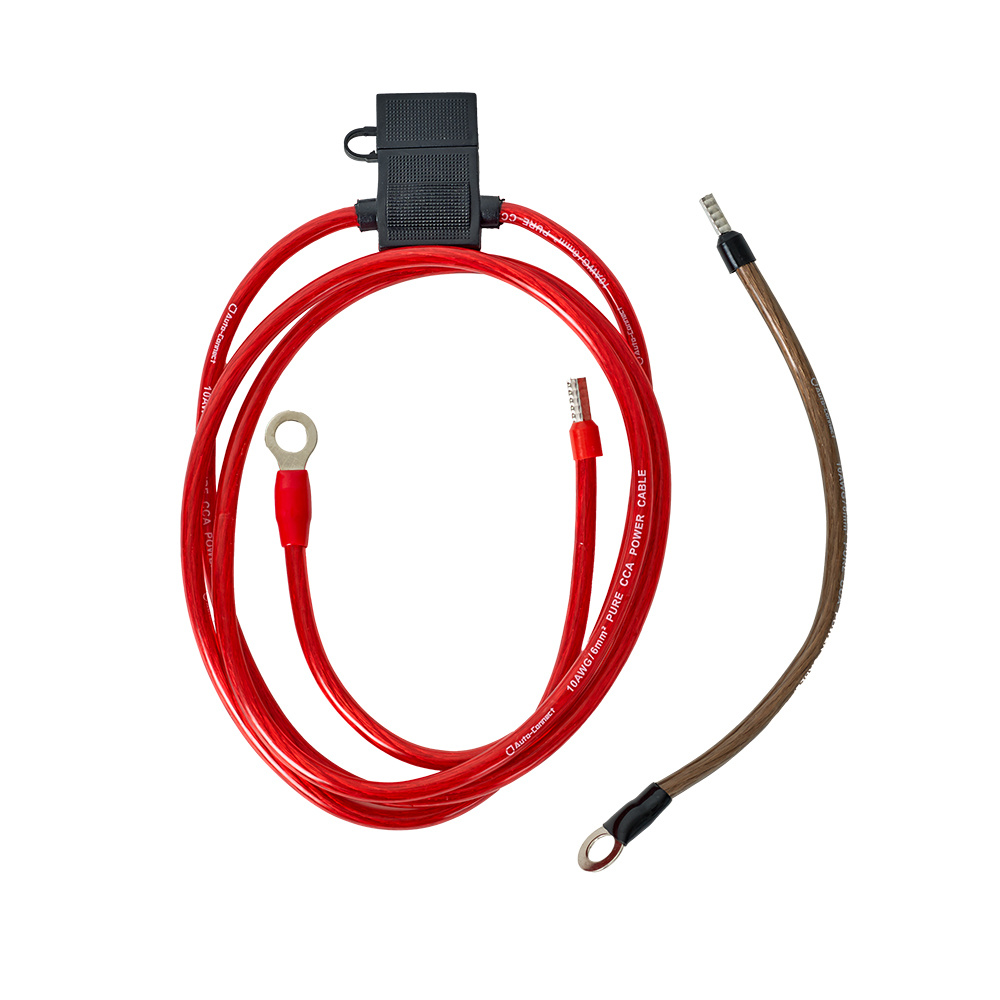 Strömkabelkit med röd och brun kabel, anslutningar och säkring.
