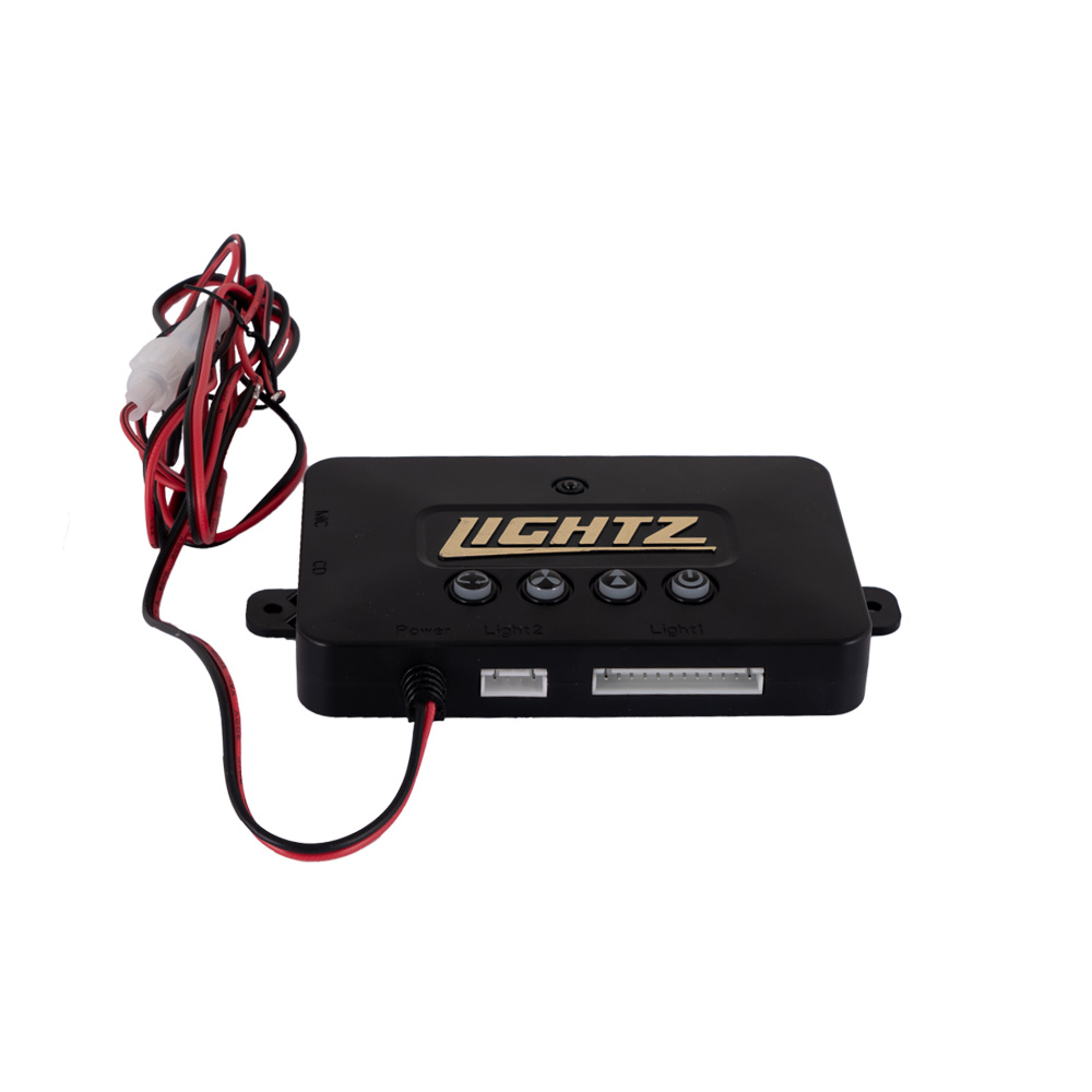 Kontrollpanel för LED-exteriörbelysning med knappar och kablar.