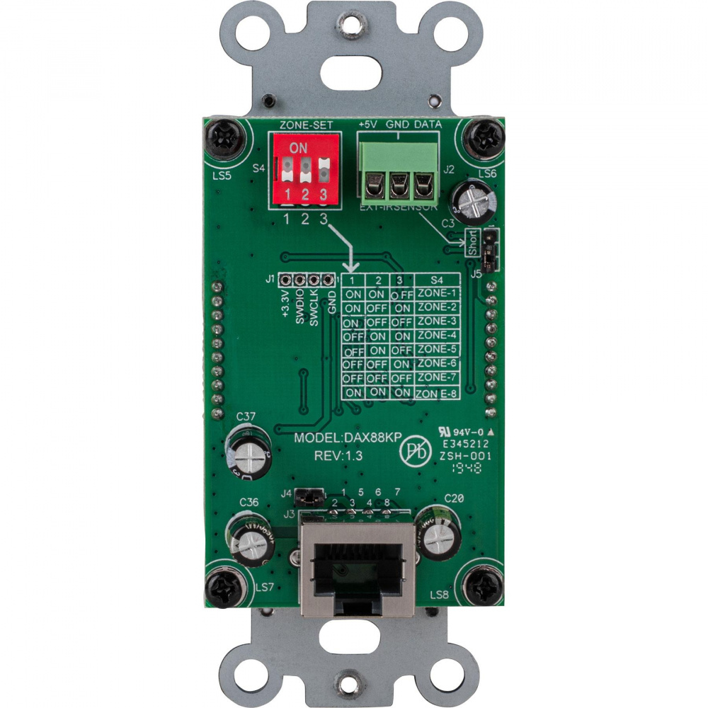 Grön kretskort med kontakter och inställningsswitchar för ljudsystem.