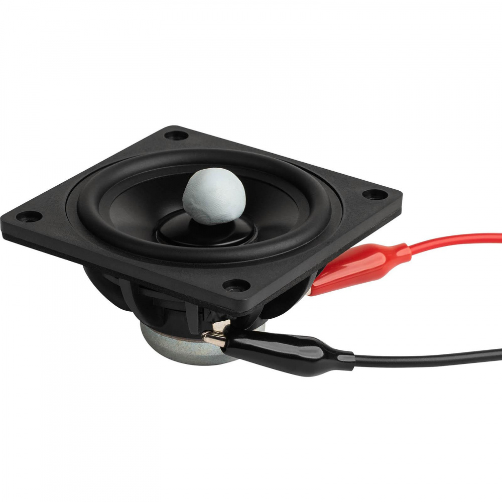 En liten högtalare med vikter på en platta för mätning.