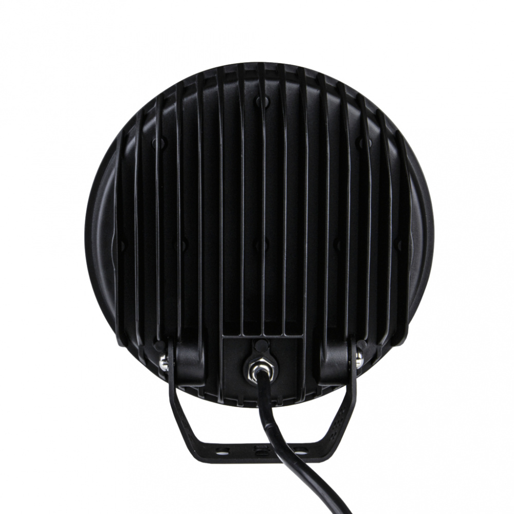 Rund extralampa med svart hölje och kylflänsar bak.