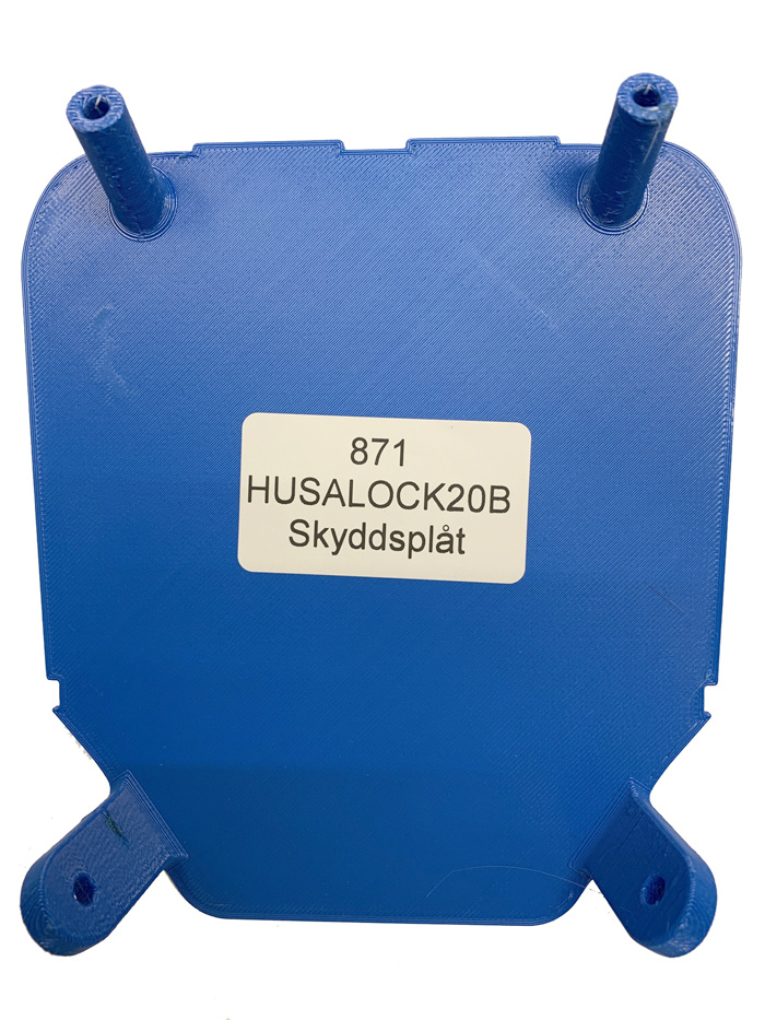 Skyddsplåt för lamphus, blå, med fästen och etikett.