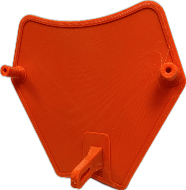 En orange skyddsplåt i plast för lamphus, formad som en trekant.