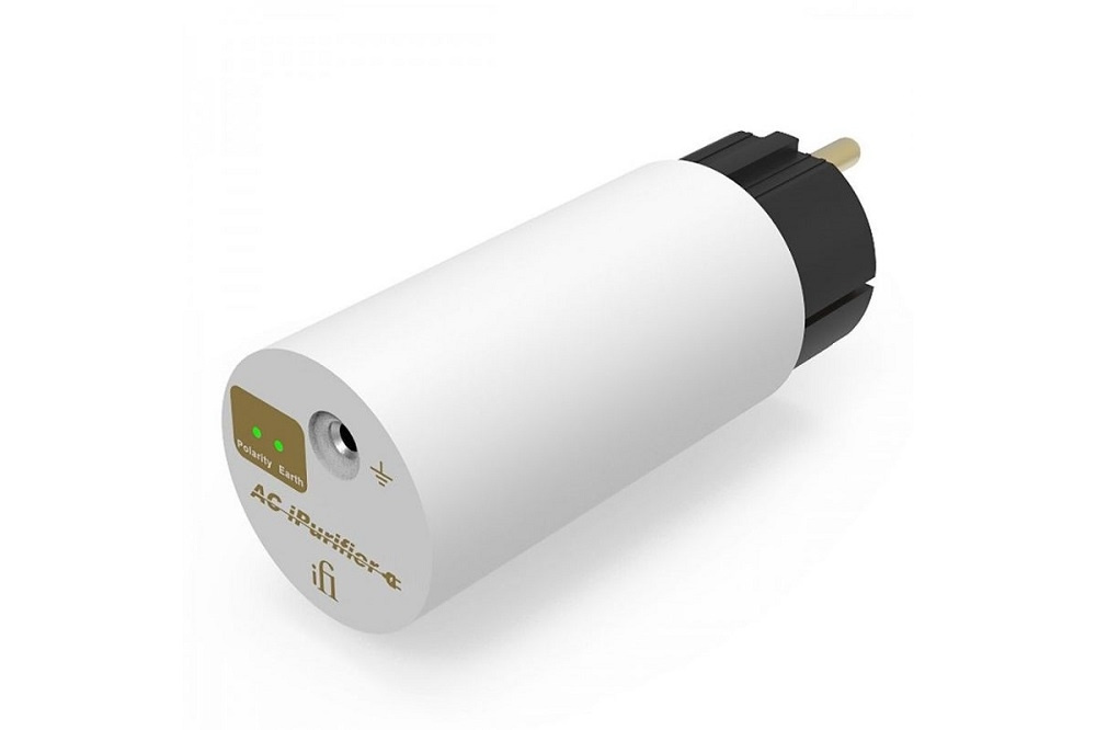 Ett vitt, cylindriskt nätfilter med en kontakt och indikatorlampa.