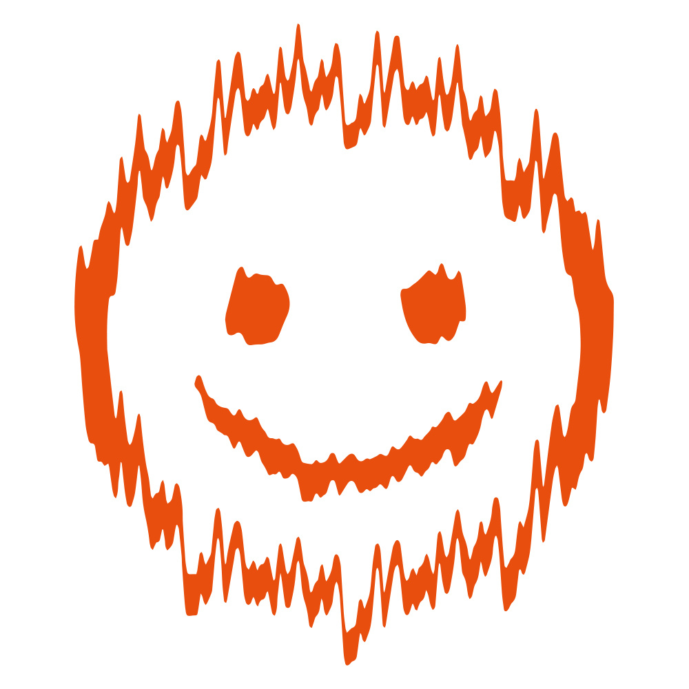 En orange figur med ett leende ansikte och vågiga kanter.
