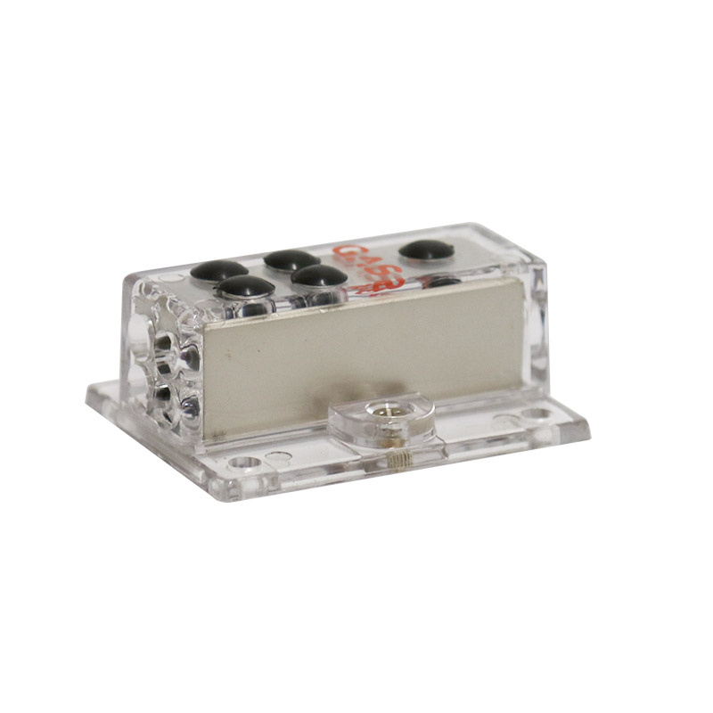 Ett transparent distributionsblock med anslutningar för kablar.