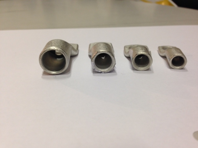 Fyra ringkabelskor i olika storlekar, förtennad ren koppar.