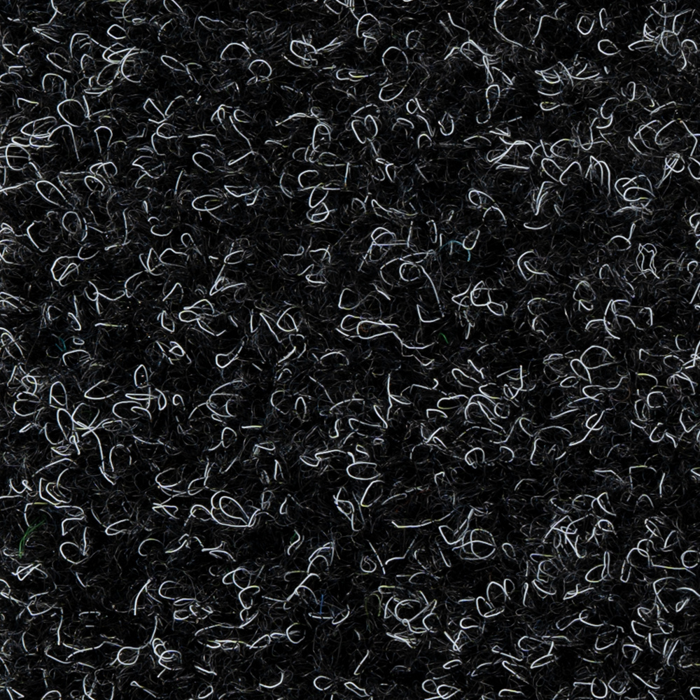 Grov struktur av konstgräsmatta i svart med inslag av vitt.