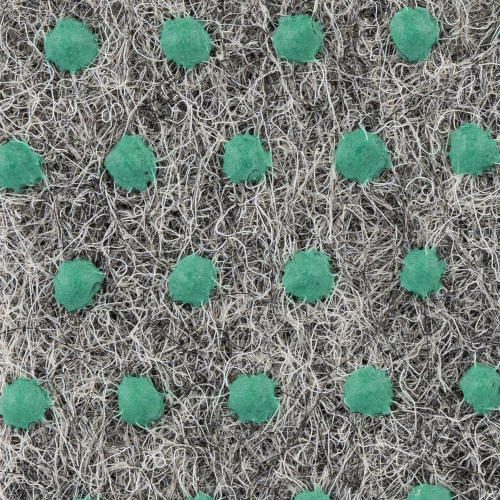 Golv-/konstgräsmatta med gröna punkter på en svart och grå yta.