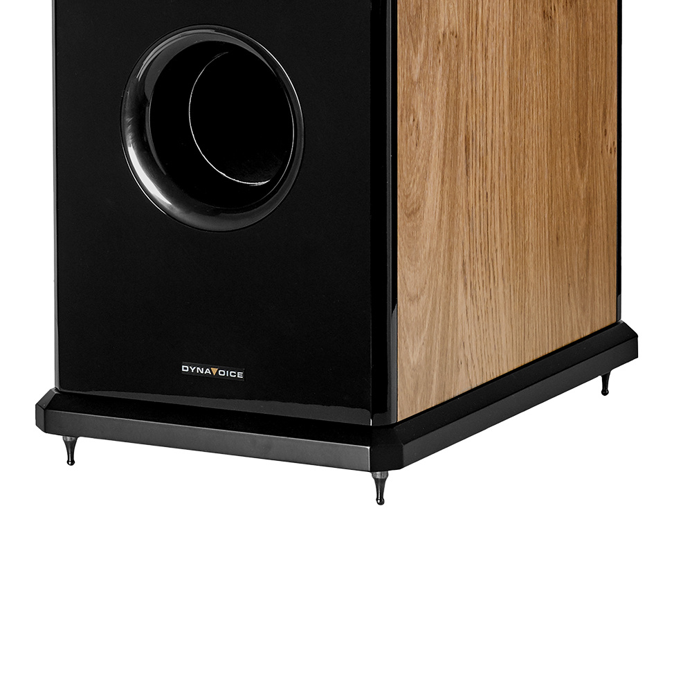 Golvhögtalare med en kombination av svart och ekfinish. Elegant och modern design.