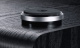 Magnat Alpha RS12 subwoofer, svart En svart subwoofer med en rund bas och metallisk kant.