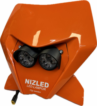 Lampkåpa i orange med två LED-lampor, designad för KTM motorcyklar.