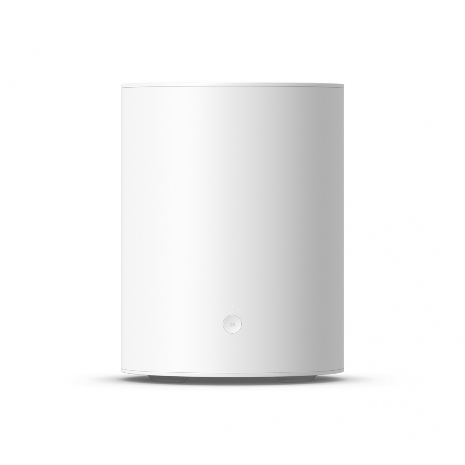 Vit, cylindrisk högtalare med minimalistisk design och knapp framtill.