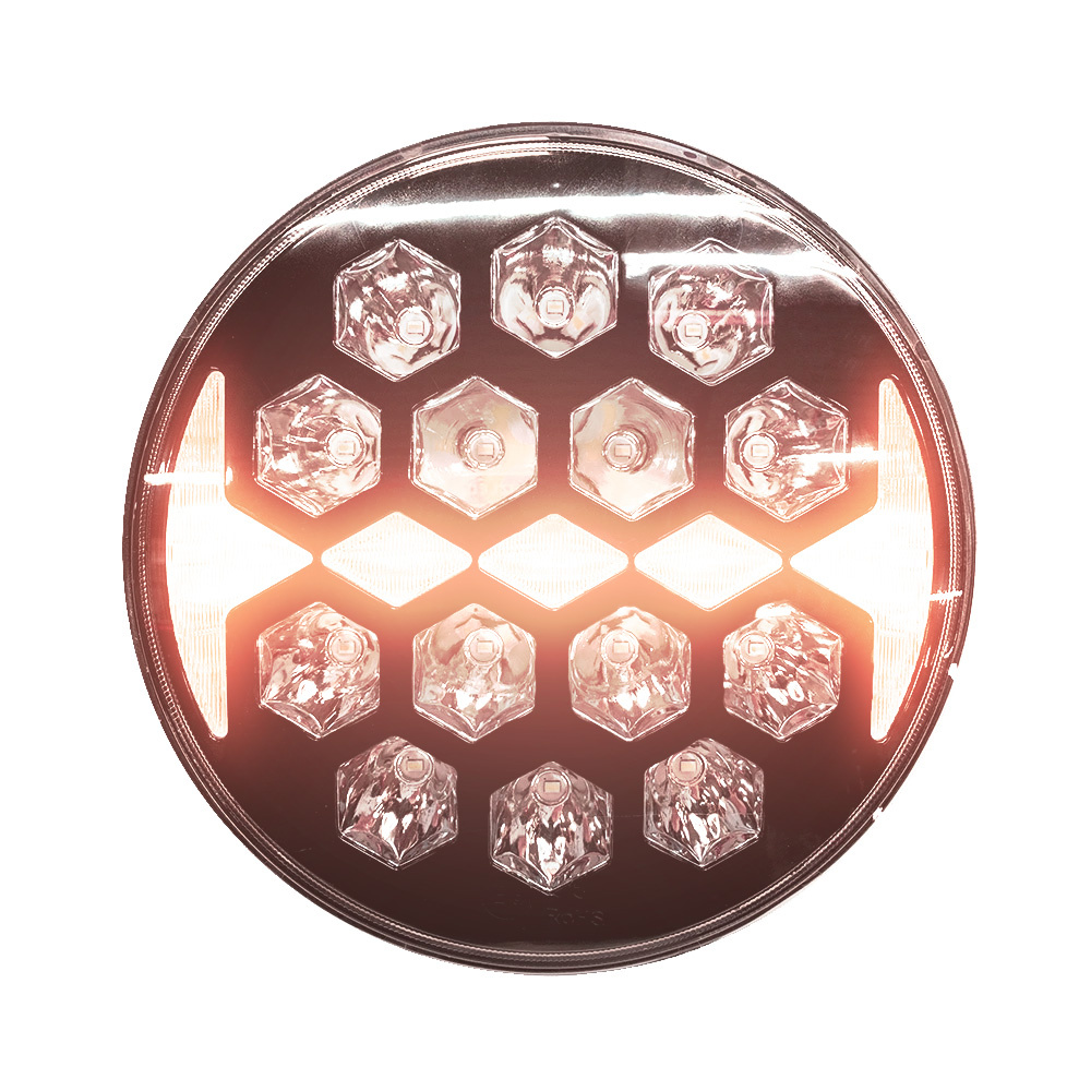 Rund extraljus med flera lampor och en kabelstam för montering.