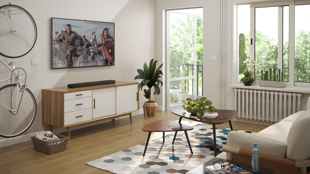 Ett modernt vardagsrum med en soundbar, växter och en tv på väggen.