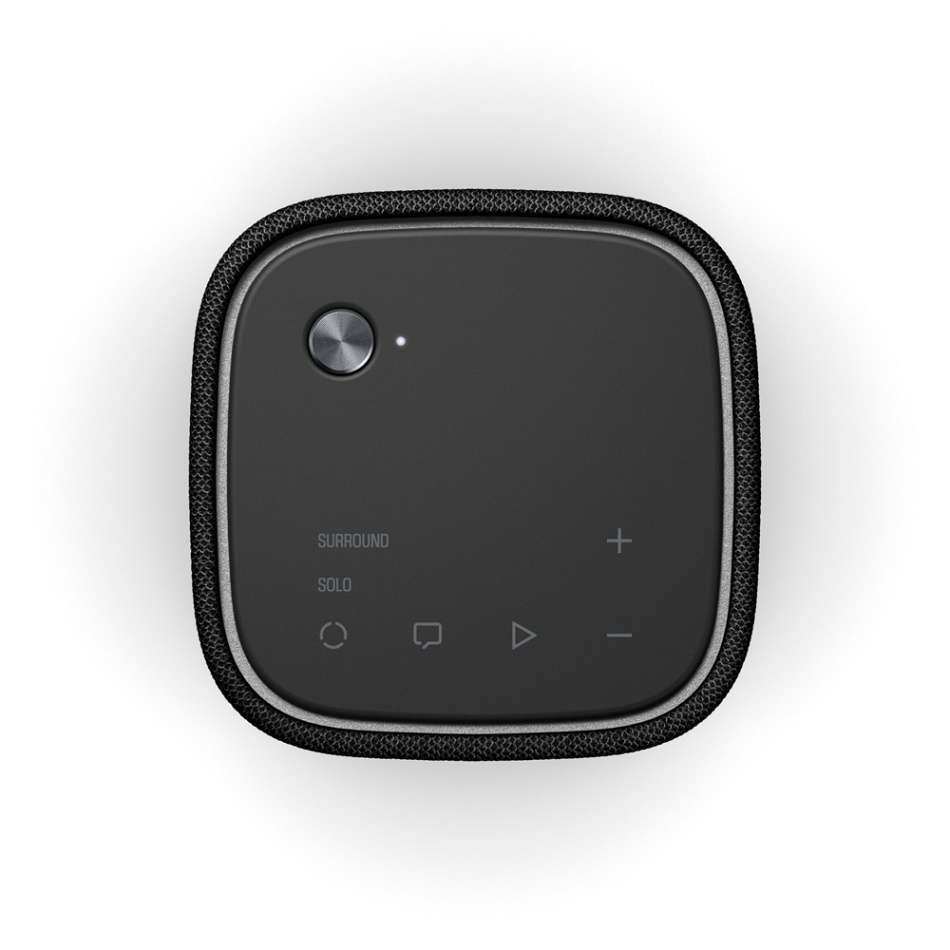 Svart ljudenhet med kontroller för volym och ljudläge.